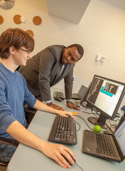 Student and professor at computer