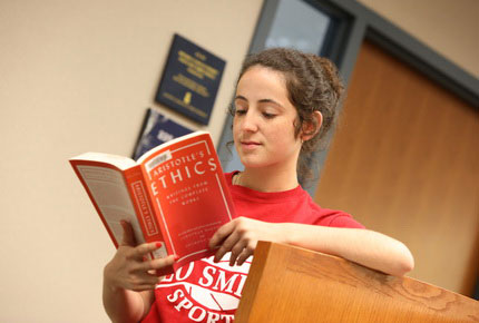 Student reading ethics book