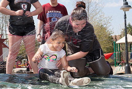 Student and child playing