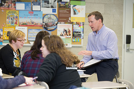 Professor talking with students