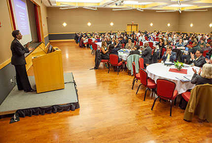 Professor speaking at podium