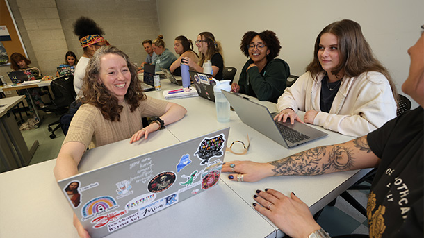 professor working with students during class
