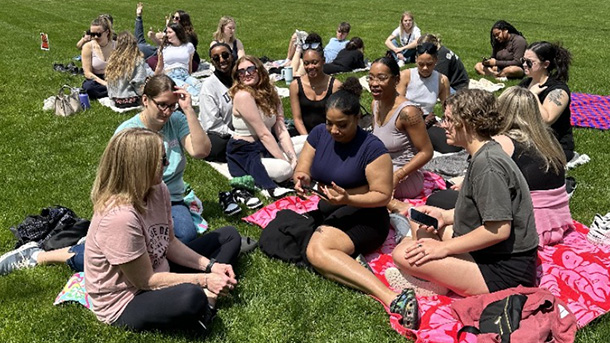 students sitting outdoors