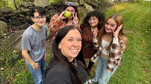 professor taking a selfie with their students