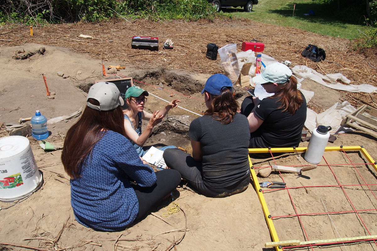 Professor and students at a dig site