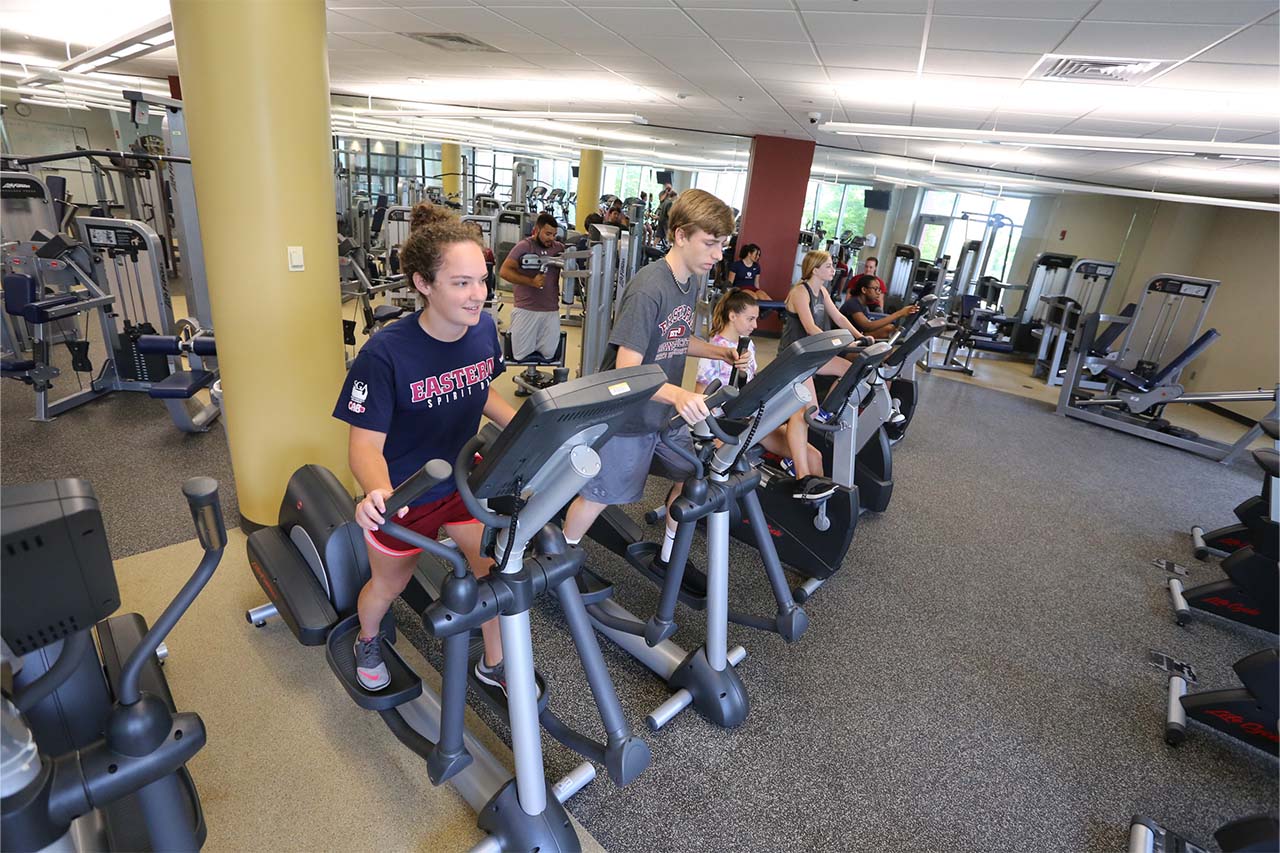 students using elliptical machines