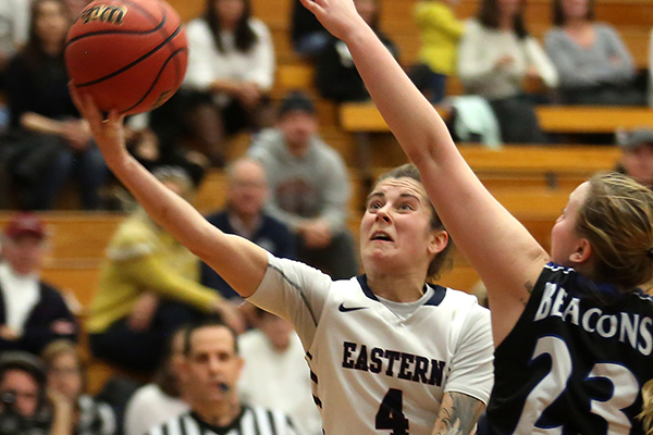 girl taking a basketball shot in a game