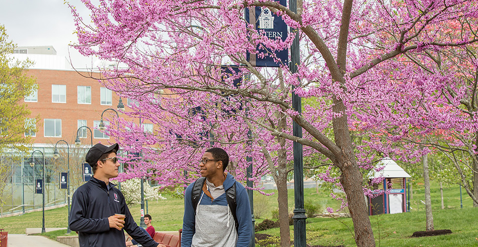 students talking near the entrance of the student center