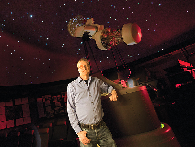 Professor Sampson in Planetarium with star background