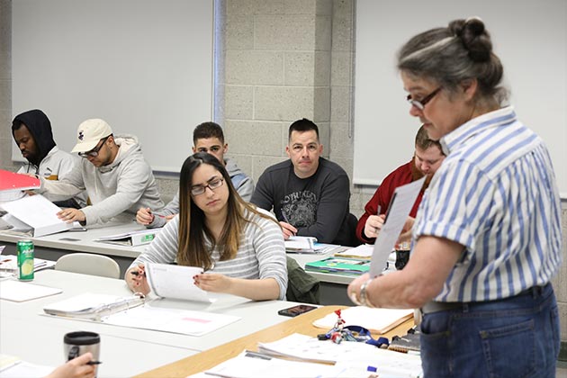 Professor teaching in front of class